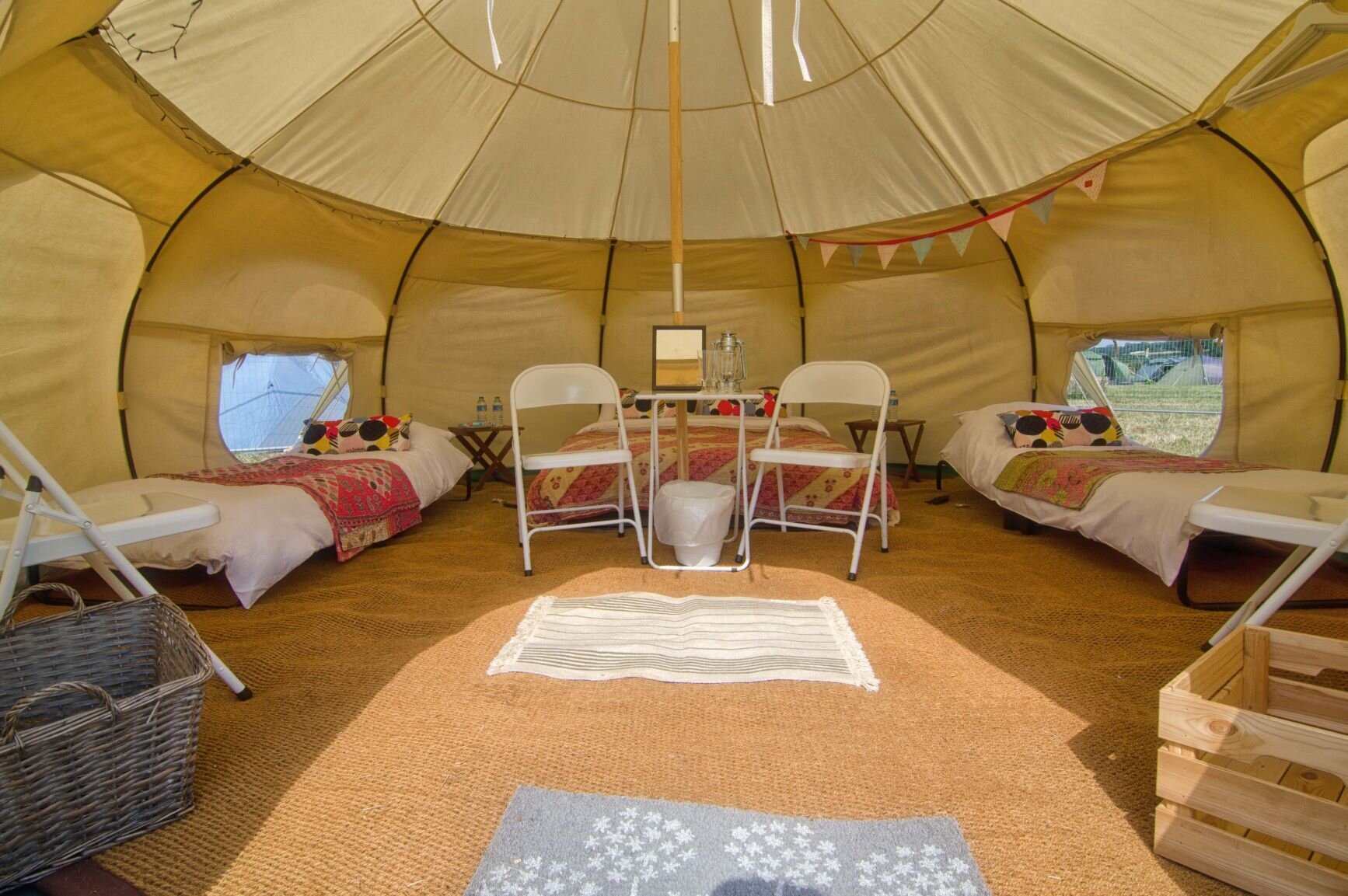 Glamping  - Glamping offers all the upsides of an outdoorsy holiday in an easy, comfortable and stress-free way. Our bell tents are set up for you before you arrive, complete with proper beds and bedding. Experience luxury camping in amazing locations around Cornwall as part of the Travelling Feast. 